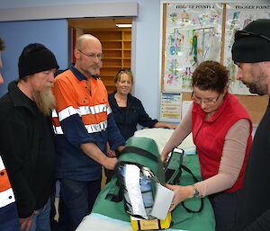 Doctor Jan familiarises the team with the oxygen set.