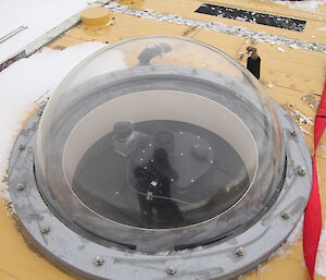Glass half-dome bolted into a base used for the Leibniz-Institute of Atmospheric Physics.