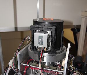 University of Western Ontario Scanning Radiometer at Davis — a cylinder with many leads attached — that measures the light intensity of the hydroxyl layer.