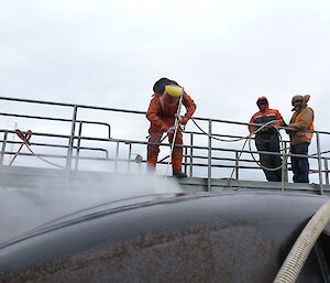 Cleaning the outside of the fuel tanks at Davis