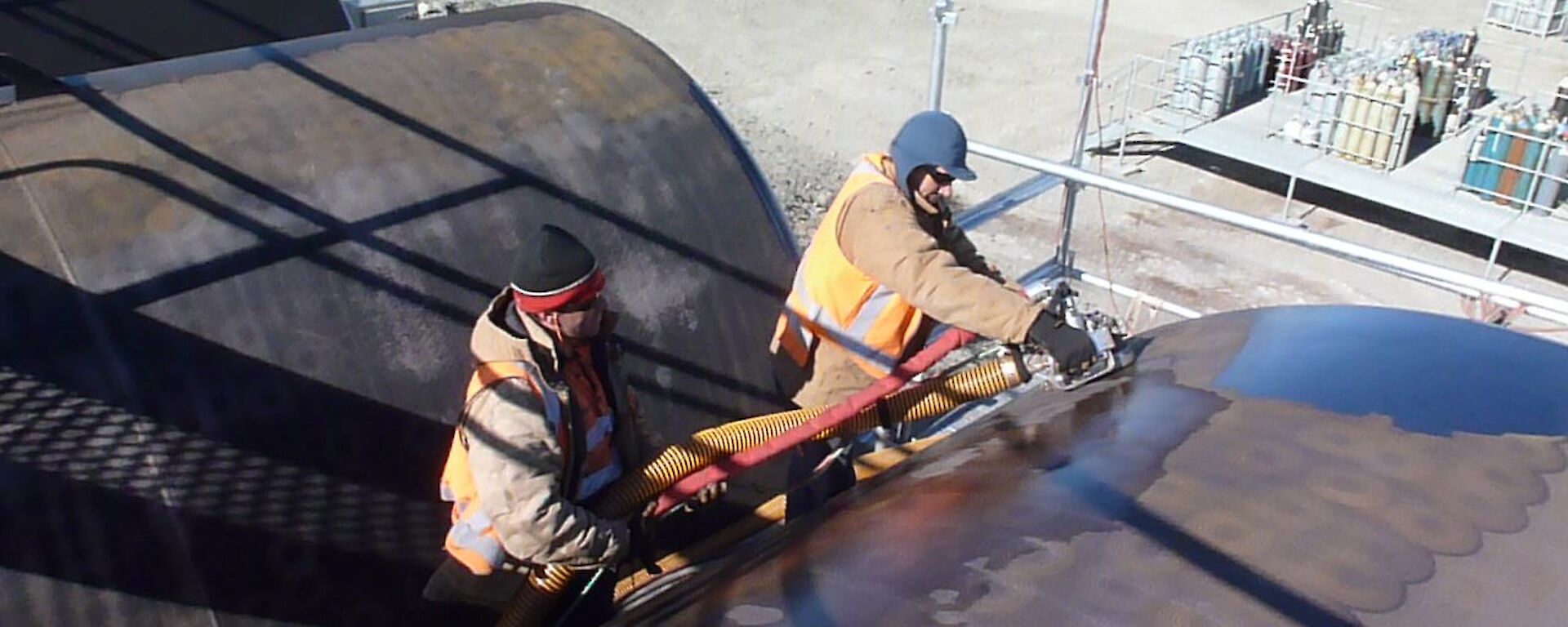 Cleaning the outside of the fuel tanks at Davis