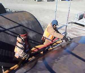 Cleaning the outside of the fuel tanks at Davis