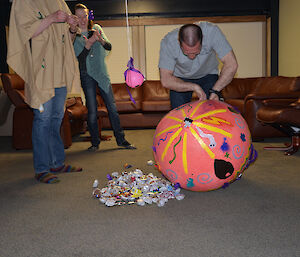 Davis Mexican theme night piñata on the floor with sweets spilling out