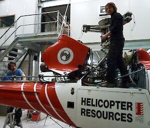 (Pictured from left) Ben Thomas (AME) and Jeremy Dyer (LAME) performing a 100 hour maintenance release on a Euro copter Squirrel AS350B2 Helicopter.