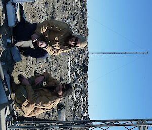 Pictured from left) David Tulloh & Adam Christensen maintaining one of the many radar installations at Davis,.