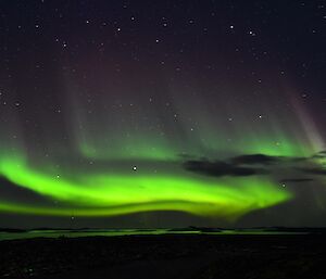 Green aurora lights up night sky