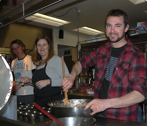 Davis Master-chef Competition Bonny gets help with her muffins from Joe and Lucas