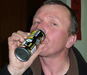 Davis expeditioner drinking coconut juice