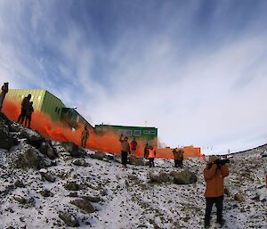 Expeditioners waving farewell to the ship