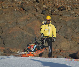 Lowering the stretcher over the edge of the wind scoop..