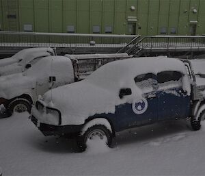 Vehicles covered with snow at Davis