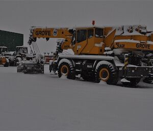 Vehicles covered with snow