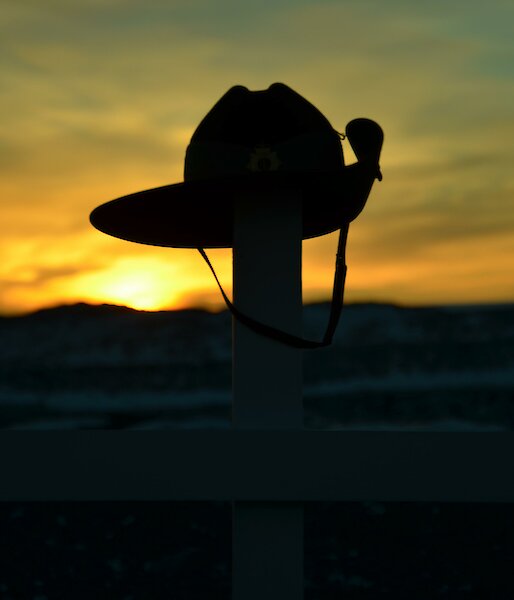 Sunrise at Davis Anzac Day 2012 — sunrise behind army hat