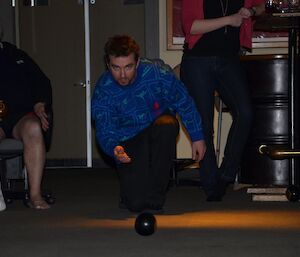 Playing carpet bowls at Davis — Joe bowls towards the camera