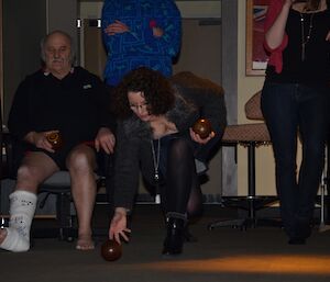 Playing carpet bowls at Davis — a female expeditioner bowls the ball for the senior’s team