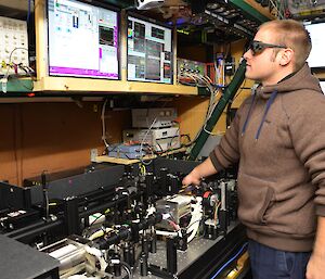 Man in the lab working on the Lidar equipment