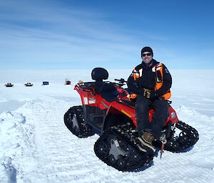 Matt Ryan sitting on a small vehicle