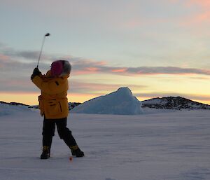 Jan Wallace playing golf Davis 2012 teeing off with sunset behind