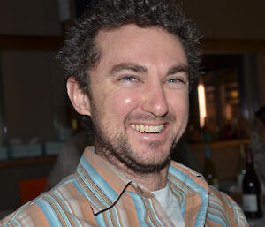 Joe Glacken at Davis 2012. Portrait with striped shirt.