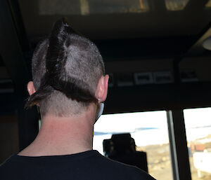 Joe Glacken at Davis 2012 with fish tail haircut (shot is of back of head)