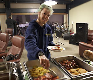 Brunch at Davis midwinter 2012. Ferret selecting bacon from buffet