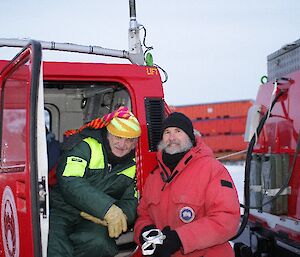 Rob Cullen and Stephen Edwards Davis 2012 posing at red vehicle