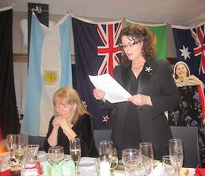 Jan Wallace at Davis 2012 reading a story at dinner