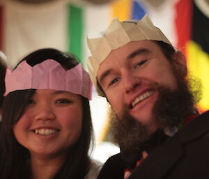 Mel Ho and Linc Mainsbridge pose at dinner table during Davis midwinter dinner 2012