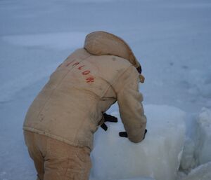 Scott Beardsley at Davis 2012 rolling a large chunk of ice or snow