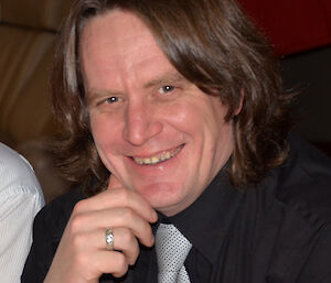 Scott Beardsley at Davis 2012 smiling during midwinter dinner