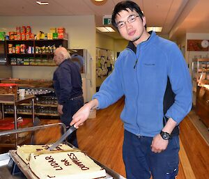 Nick Chang cutting his thesis cake at Davis 2012