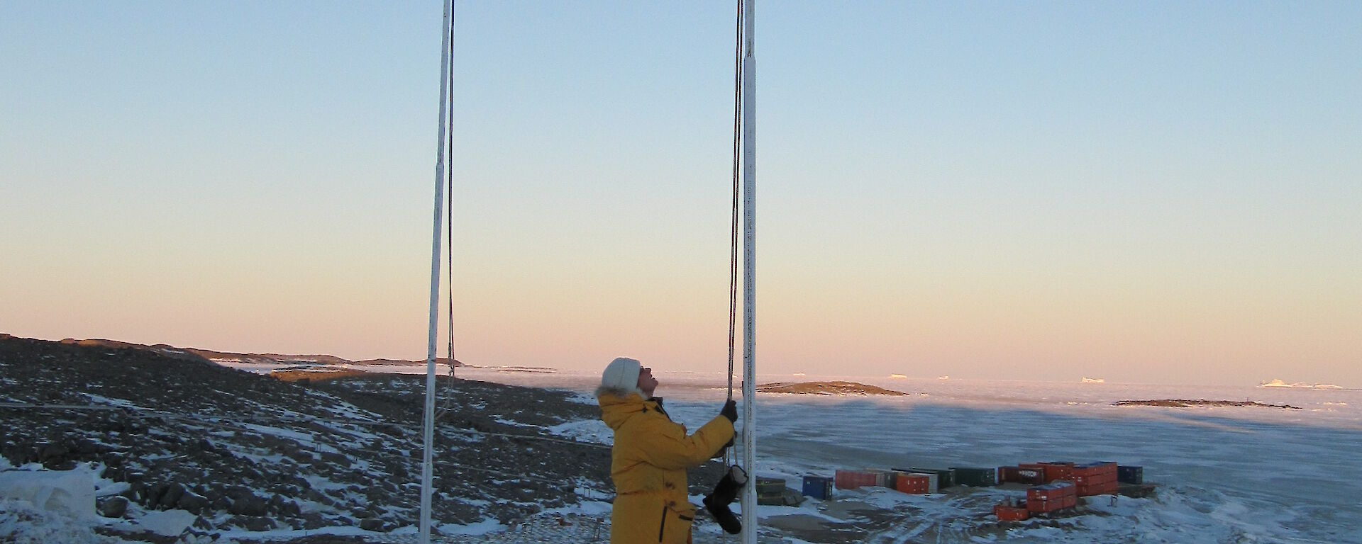 Jan Wallace raising the flag at Davis