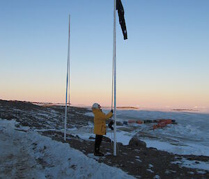 Jan Wallace raising the flag at Davis