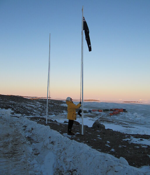 Jan Wallace raising the flag at Davis