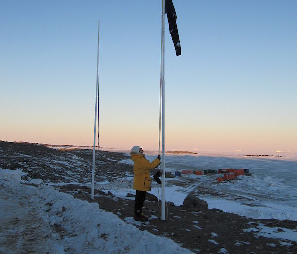 Jan Wallace raising the flag at Davis