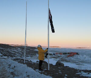 Jan Wallace lowering the flag at Davis