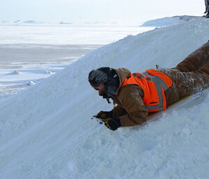 Man sledging down the hill