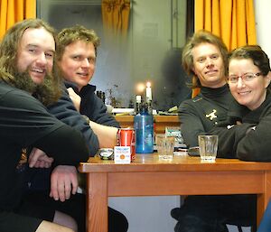 Expeditioners inside a hut