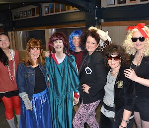 Group photo of the women at Davis in 80s costume