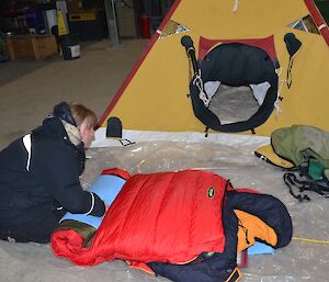 Trip preparations at Davis 2012, rolling up the bedroll