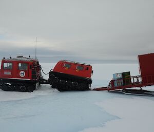 Red Hägglunds down a crevasse