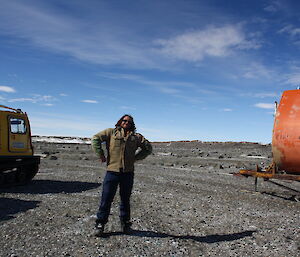 Expeditioner poses with RMIT van