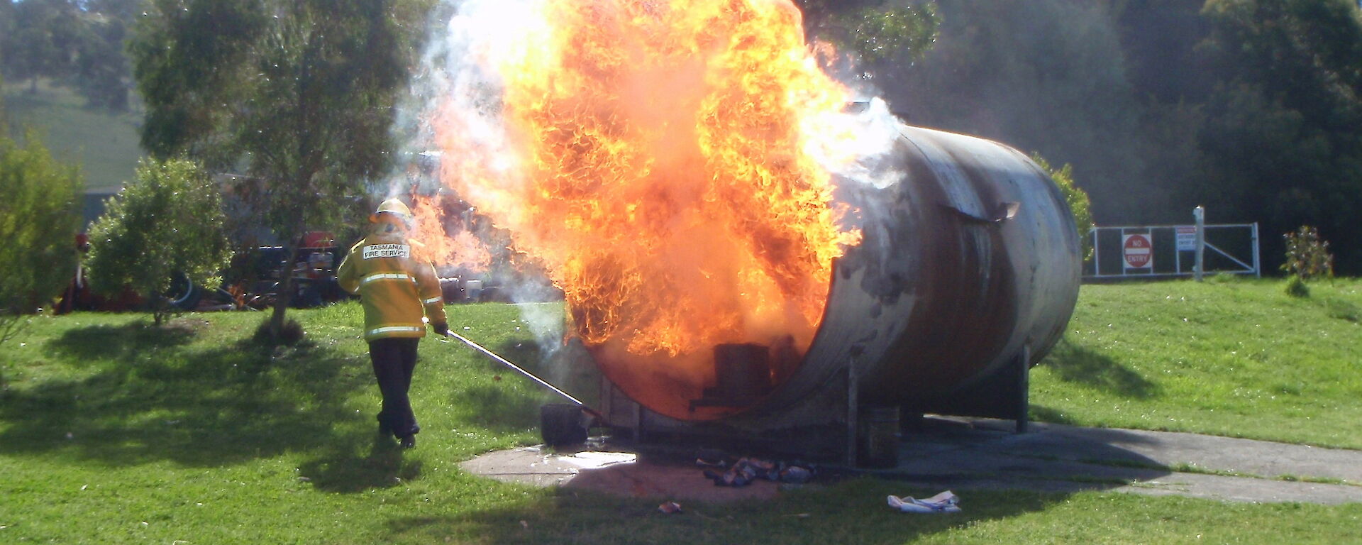 A large fire ball comes out of a gas tank during fire fighting training at Kingston