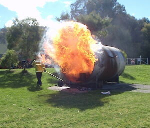 A large fire ball comes out of a gas tank during fire fighting training at Kingston