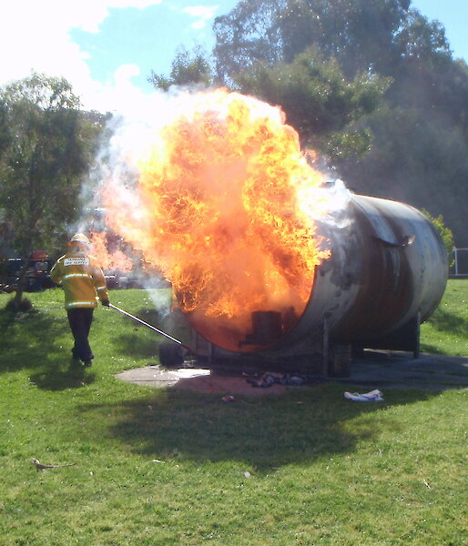 A large fire ball comes out of a gas tank during fire fighting training at Kingston