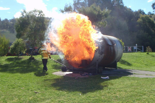 A large fire ball comes out of a gas tank during fire fighting training at Kingston