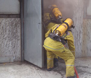 Expeditioners entering a burning building