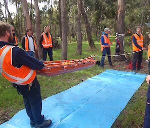 Search & rescue training at Hobart — expeditioners use a blue plastic sheet in place of ice