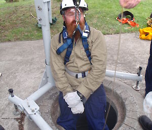 Expedtioner lowered into a confined space for training