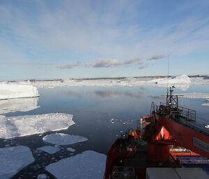 Expeditioners standing on the ships deck as Davis comes into view